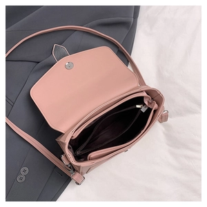Internal view showing zipper pocket and brown lining of the lychee grain crossbody bag