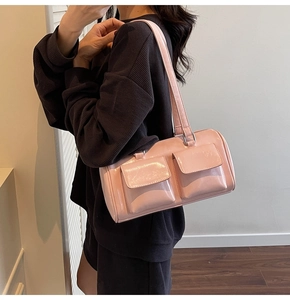 Pink patent leather underarm pillow bag with double flap pockets and glossy finish