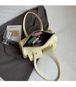 Top view of cream yellow shoulder bag with double pockets showing spacious interior storage