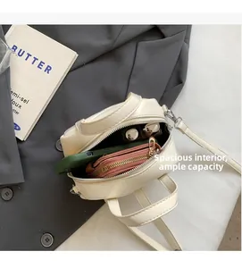 Top-down view of the cream PU shell bag interior showing ample storage for daily essentials