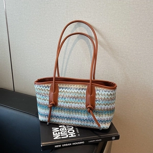 Minimalist woven wave pattern tote bag with brown faux leather handles and knot accents