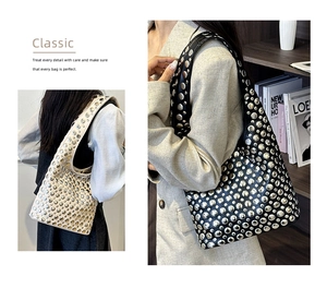 Detail of vintage punk bucket bag with silver metal studs and premium leather texture