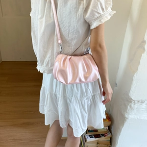 Fashionable pink pleated cloud shoulder bag with glossy finish and thin strap