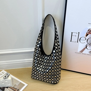 Black leather hobo shoulder bag featuring dense silver metal studs and rock style