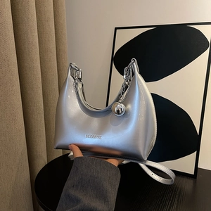 Silver metallic hobo bag with moon shape, metal ball pendant and chain strap