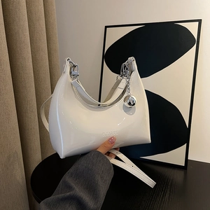 Chic white patent leather crescent dumpling bag with silver chain and metal ball charm