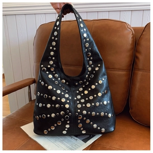 Close-up of black leather hobo bag with vintage silver rivet studs and large capacity