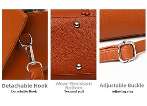 Detail view of brown pebbled leather tote showing metal hooks and anti-wear bottom studs