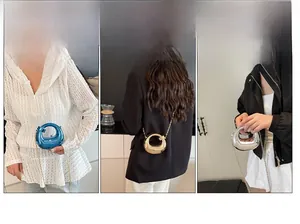 Three metallic acrylic spherical mini bags in blue, gold, and silver with metal chain straps