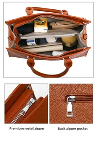 Detail of caramel lychee leather tote showing large capacity and quality hardware zippers