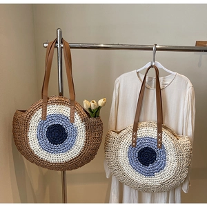 Handwoven evil eye tote bag with leather straps for beach holidays and casual style