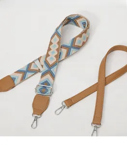 Detail of dual shoulder straps featuring geometric jacquard weave and litchi grain leather