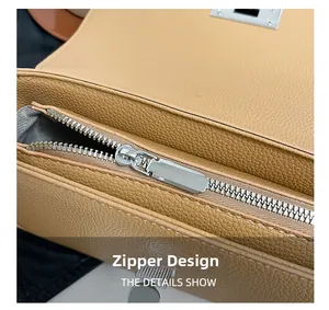Macro detail of high-quality light brown lychee grain leather bag with silver zipper