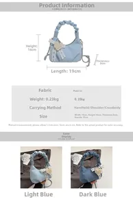 Detail view of denim handbag featuring pearl heart charm and pleated handle design