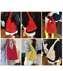 Detail of hand-crocheted hollow knit tote bag in vibrant red, yellow and beige colors