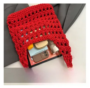 Top view of red hollow knit shoulder bag showing large capacity for tablet and daily items