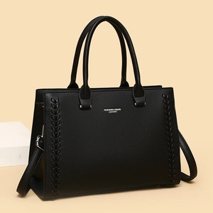 Retro black leather tote bag with woven texture details and detachable shoulder strap