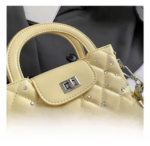 Detail of the quilted leather handbag showing the silver twist lock and sparkling rhinestones