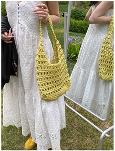 Detailed knit pattern on a lime yellow large capacity shoulder bag for summer outfits