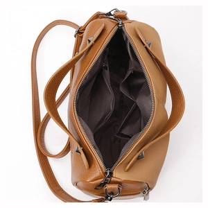 Detail view of the brown PU leather Boston bag interior with multiple compartments