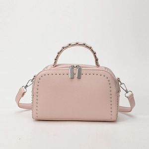 Pink lychee grain leather handbag with silver studs and chain handle details