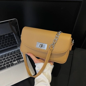 Minimalist ginger leather shoulder bag with silver chain and twist lock for women