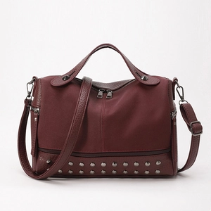 Burgundy PU leather handbag with rivet trim, double handles, and detachable shoulder strap