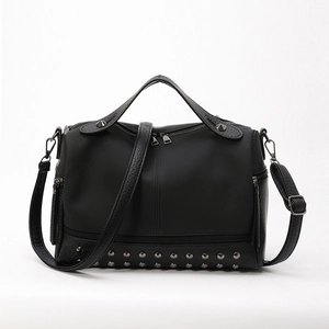 Minimalist black PU leather handbag with silver rivets and adjustable shoulder strap