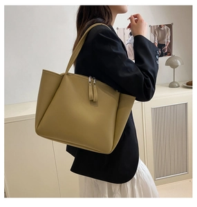 Minimalist mustard yellow tote bag shown on model for daily commuting style