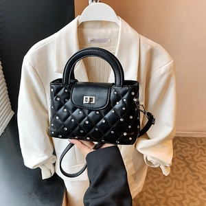 Fashionable black quilted mini handbag with silver studs and metal twist lock for women