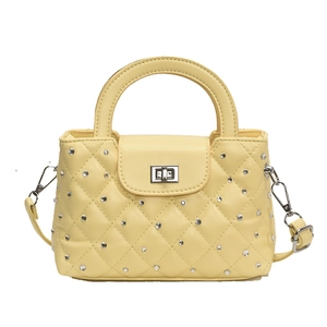 Quilted yellow handbag with silver diamond studs and detachable long strap for women