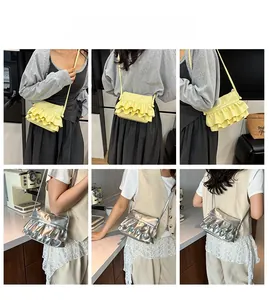 Detail showing ruffled crossbody bag in bright yellow and silver with shiny finish