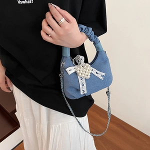 Blue denim dumpling handbag with lace bow and pearls for stylish women casual wear