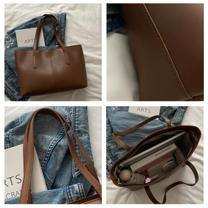 Brown leather tote bag interior detail showing large capacity for 14 inch laptop and books