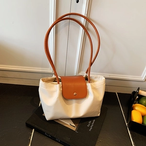 Off-white large tote bag with brown trim and golden round buckle for daily commute