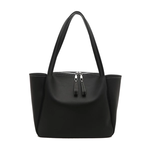 Minimalist black tote bag with white contrast stitching and silver zipper closure