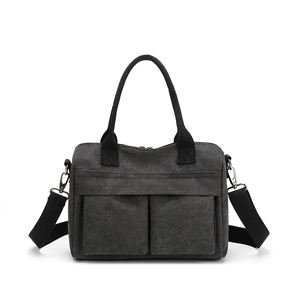 Versatile dark grey nylon canvas tote bag with front pockets and adjustable shoulder strap