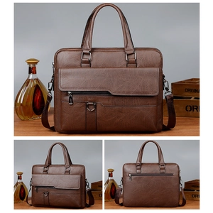 Macro detail of brown leather briefcase with litchi texture and gunmetal hardware