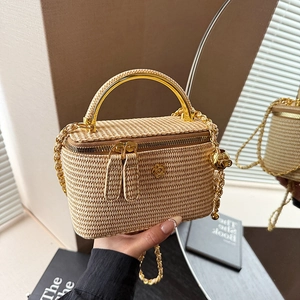 Beige woven box mini bag with golden metal handle and chain strap for elegant styling