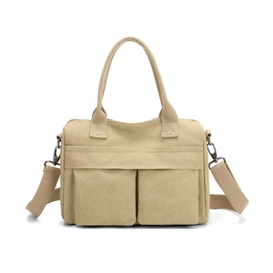 Minimalist beige nylon canvas tote bag with dual front pockets and adjustable strap