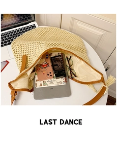 Top view of spacious straw tote bag showing interior storage capacity for iPad and essentials