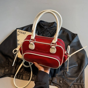 Retro red and white bowling handbag with dual zippers and adjustable shoulder strap