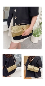 Detail of gold woven baguette bag featuring metallic texture and rotary lock clasp
