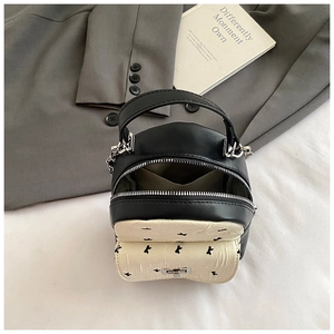 Modern black and white mini backpack with metal chain strap and bear motif