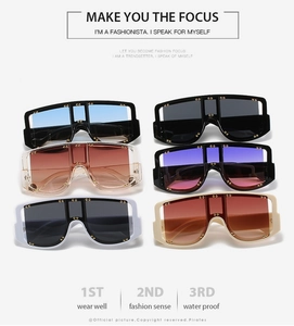 Detailed grid of oversized flat top sunglasses featuring metallic stud rivets and color tints