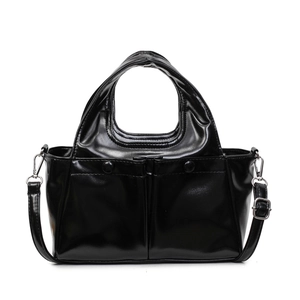 Minimalist black glossy handbag with front pockets and detachable shoulder strap