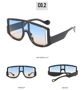 Detailed views of oversized square sunglasses with gold rivets and blue-orange gradient lenses