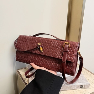 Retro burgundy woven leather baguette bag with a golden knot clasp for women