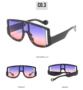 Three-angle display of oversized square sunglasses with gold studs and gradient lenses