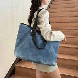 Large capacity blue denim tote bag with brown shoulder strap for casual daily use